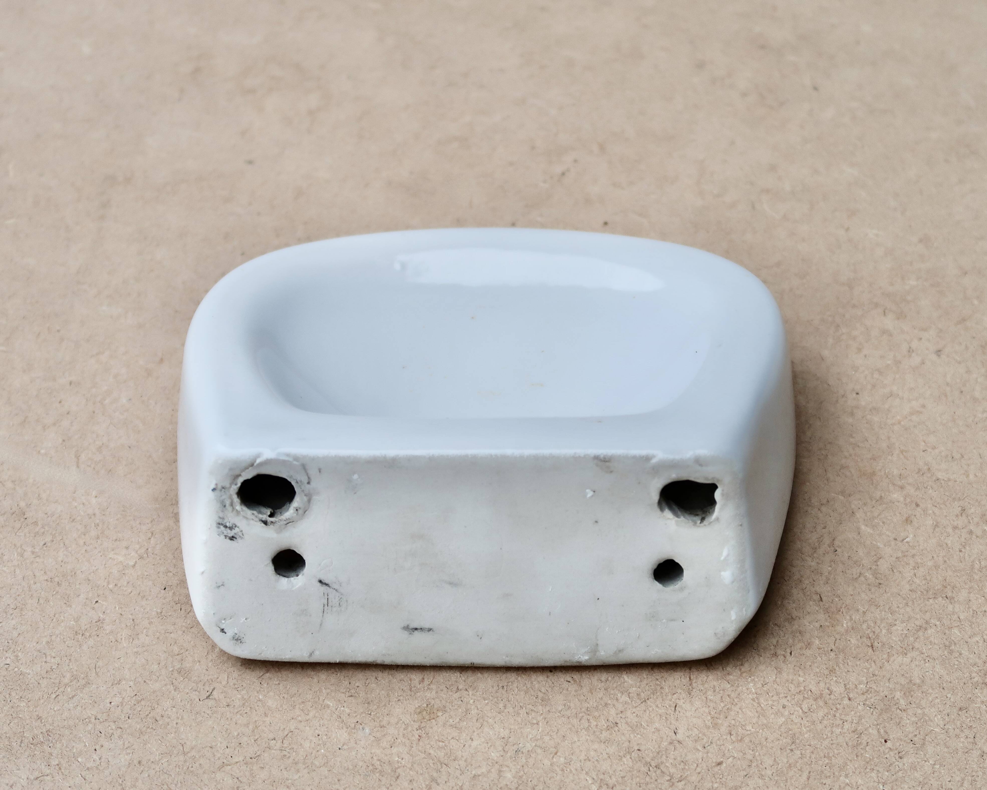 White wall-mounted soap dish in porcelain, 1950s.