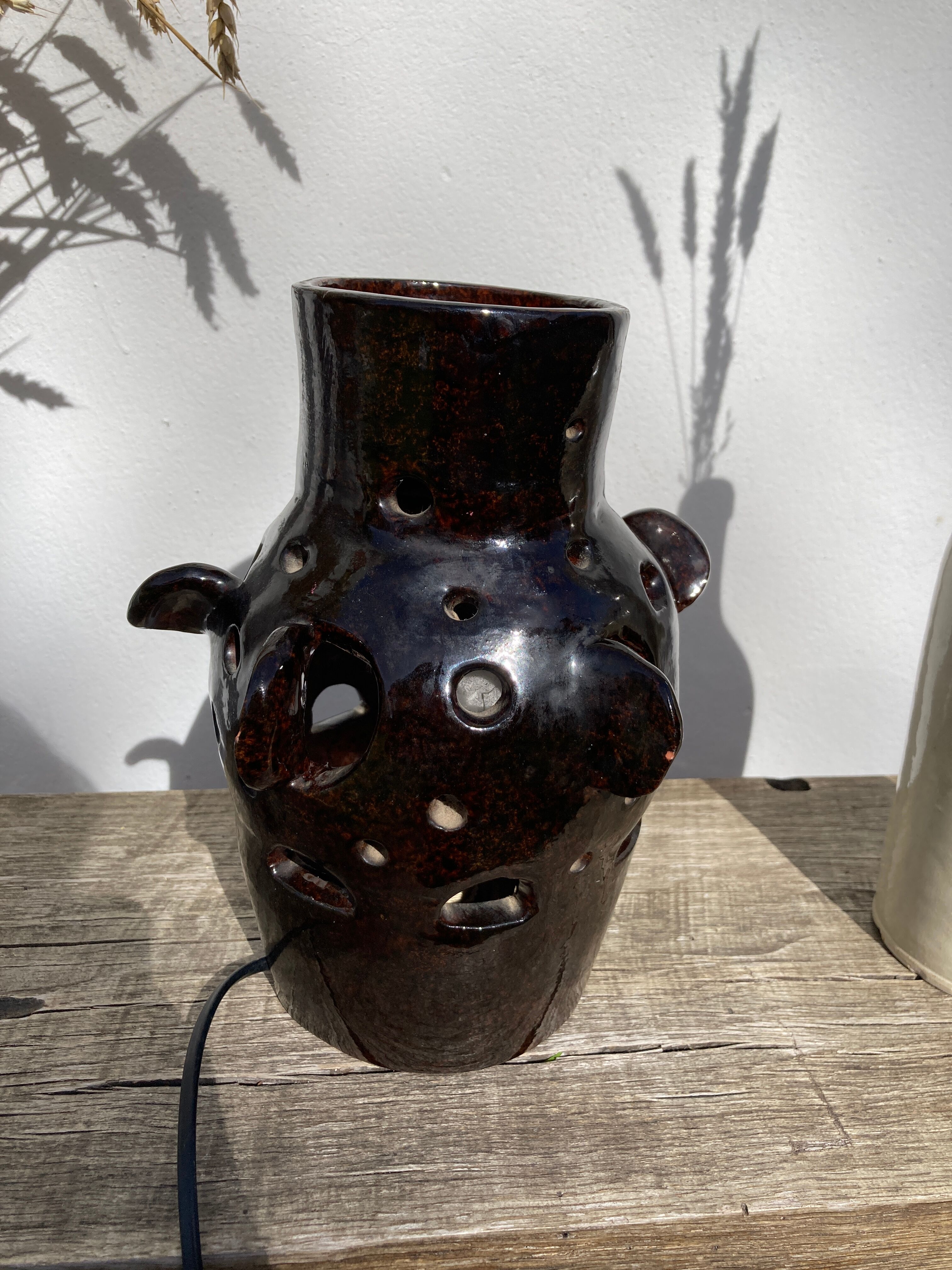 Brutalist lamp in black / brown ceramic openwork 1970