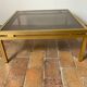 Glass and brass coffee table