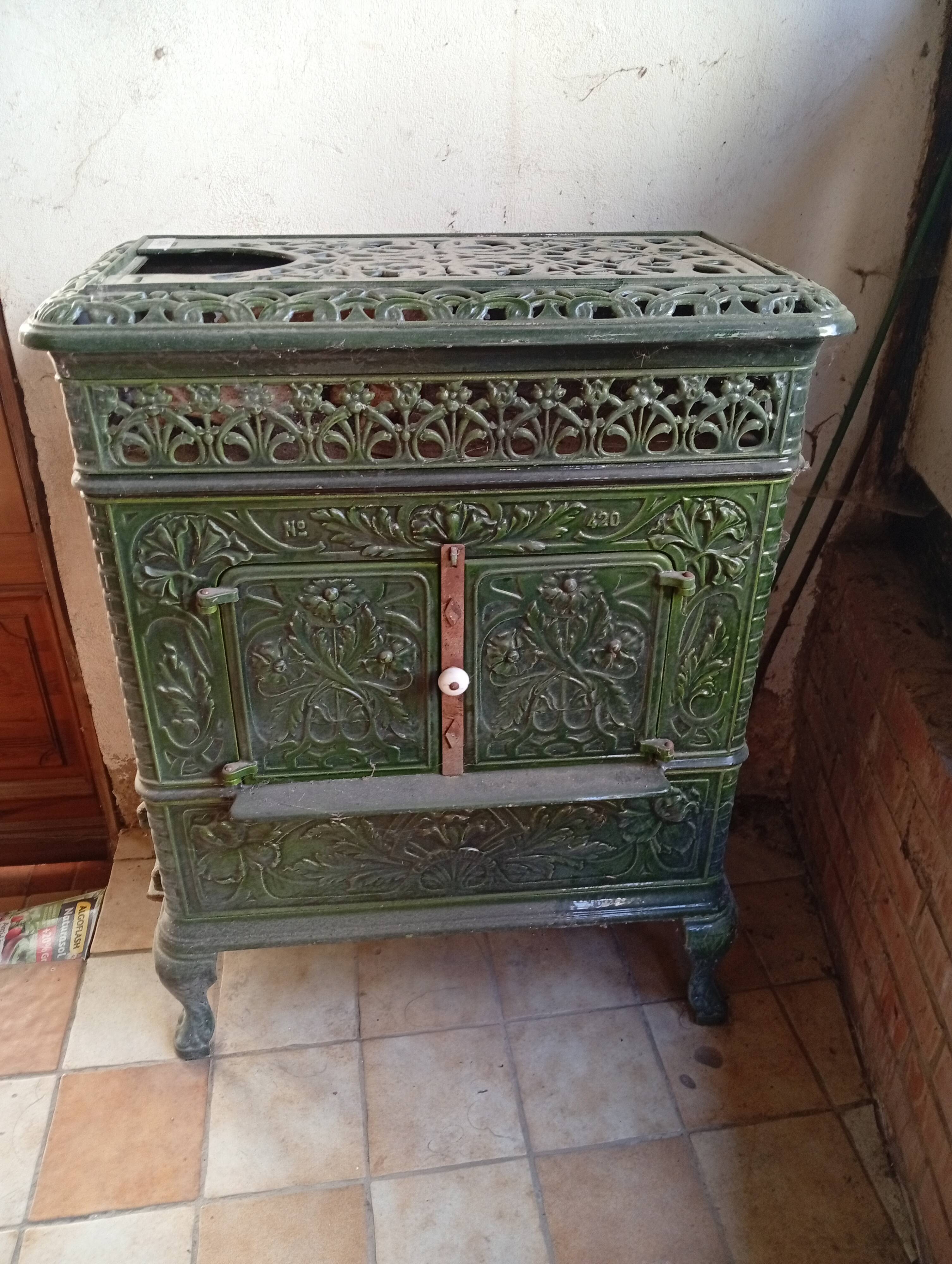 Old green enamelled cast iron pan