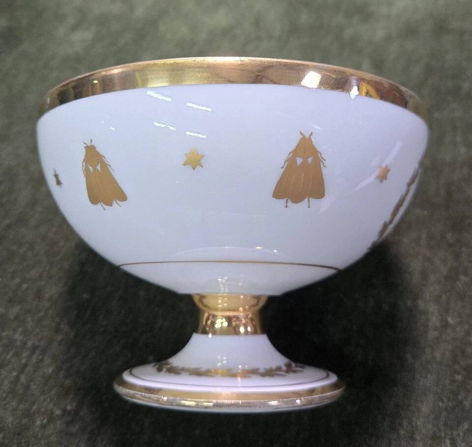 Empire-style footed cup in white porcelain, richly decorated with fine gold.
