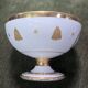 Empire-style footed cup in white porcelain, richly decorated with fine gold.