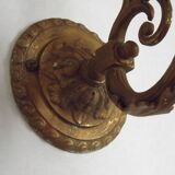 French Art Nouveau wall sconce in bronze with a white and pink glass shade.