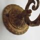 French Art Nouveau wall sconce in bronze with a white and pink glass shade.