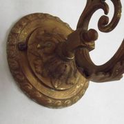 French Art Nouveau wall sconce in bronze with a white and pink glass shade.