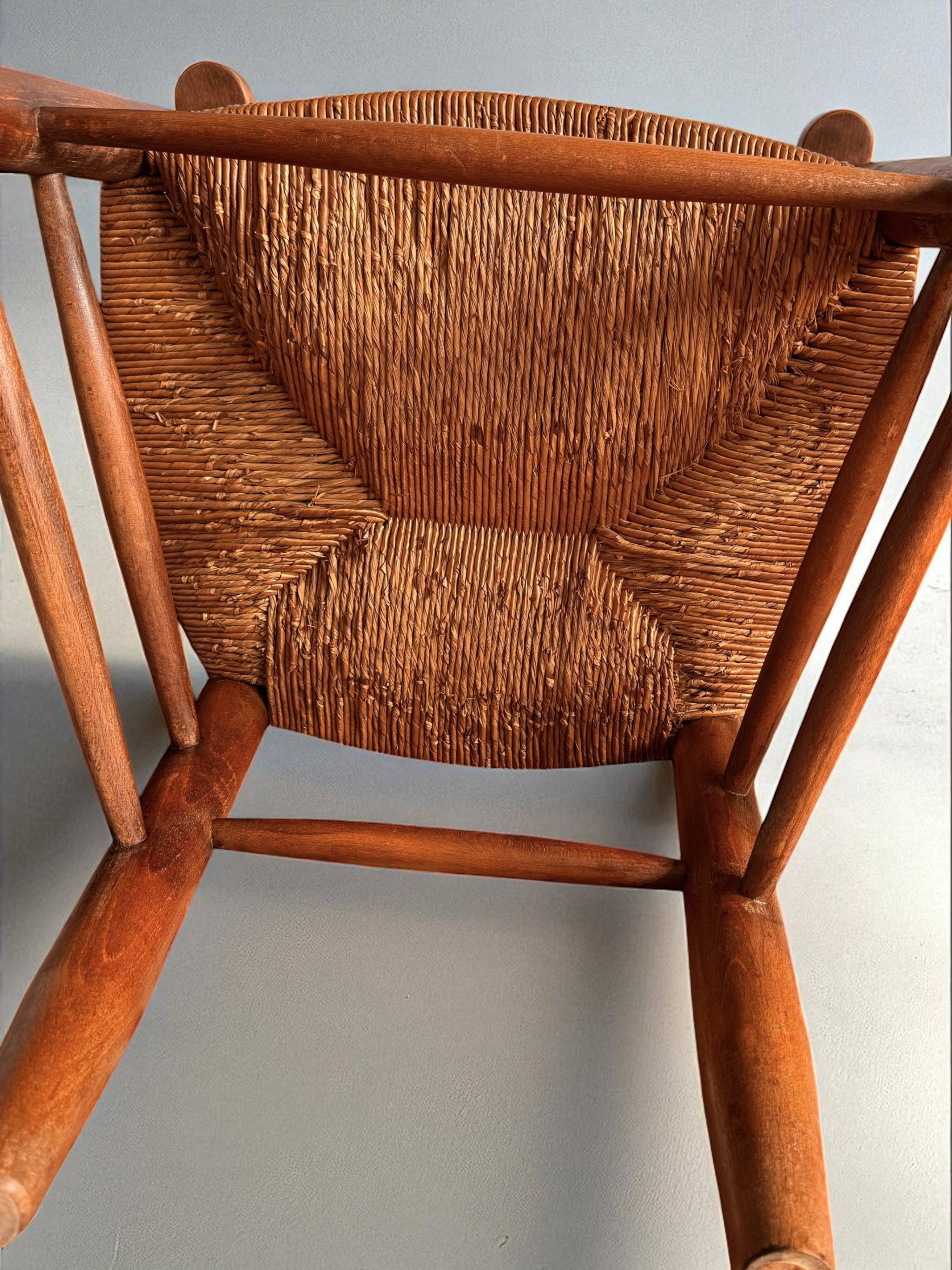 Pair of vintage armchairs in solid wood and straw – Georges Robert