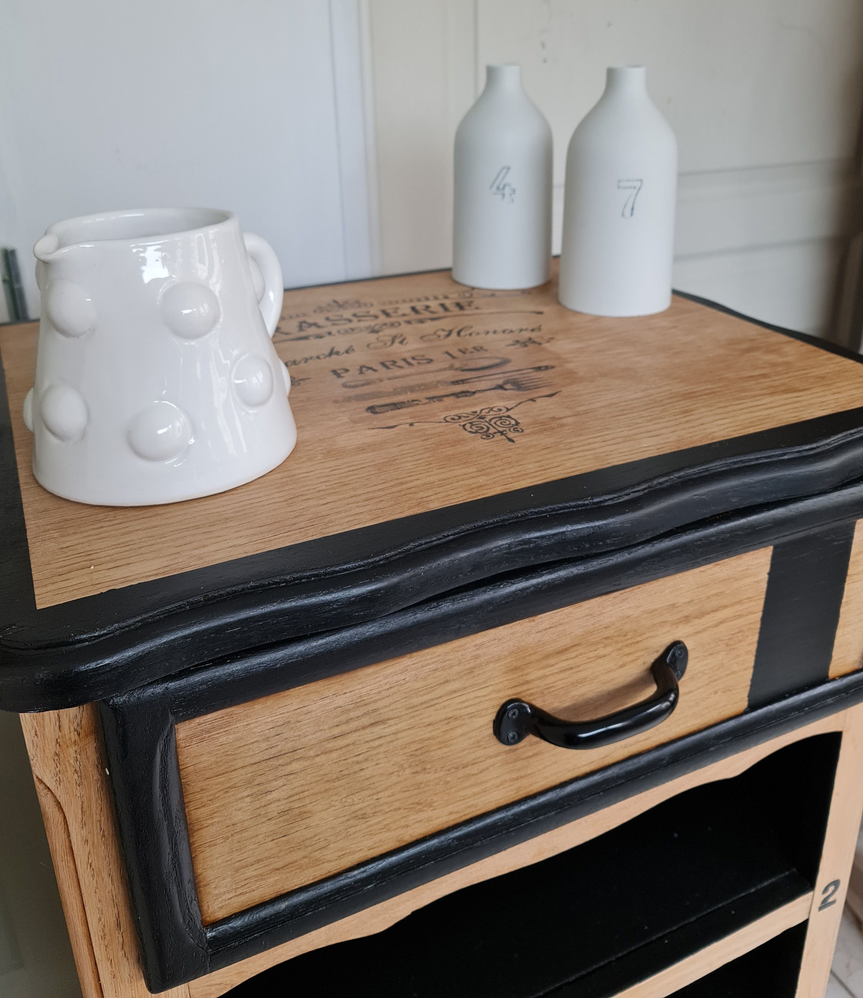 Raw oak and matte black storage cabinet on stencil top and transfer