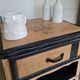 Raw oak and matte black storage cabinet on stencil top and transfer