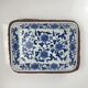 Set of 6 ceramic presentation plates in white and blue, floral pattern with woven wicker frame, 1970s/80s.