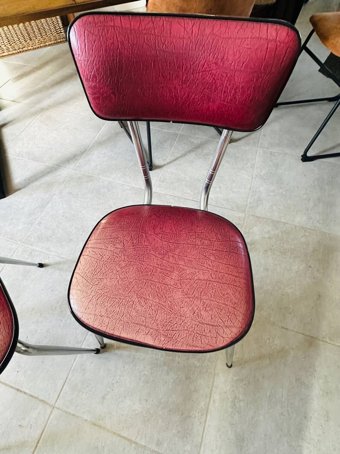 Pair of raspberry-colored chairs from the 60s/70s with metal legs