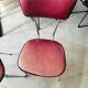 Pair of raspberry-colored chairs from the 60s/70s with metal legs