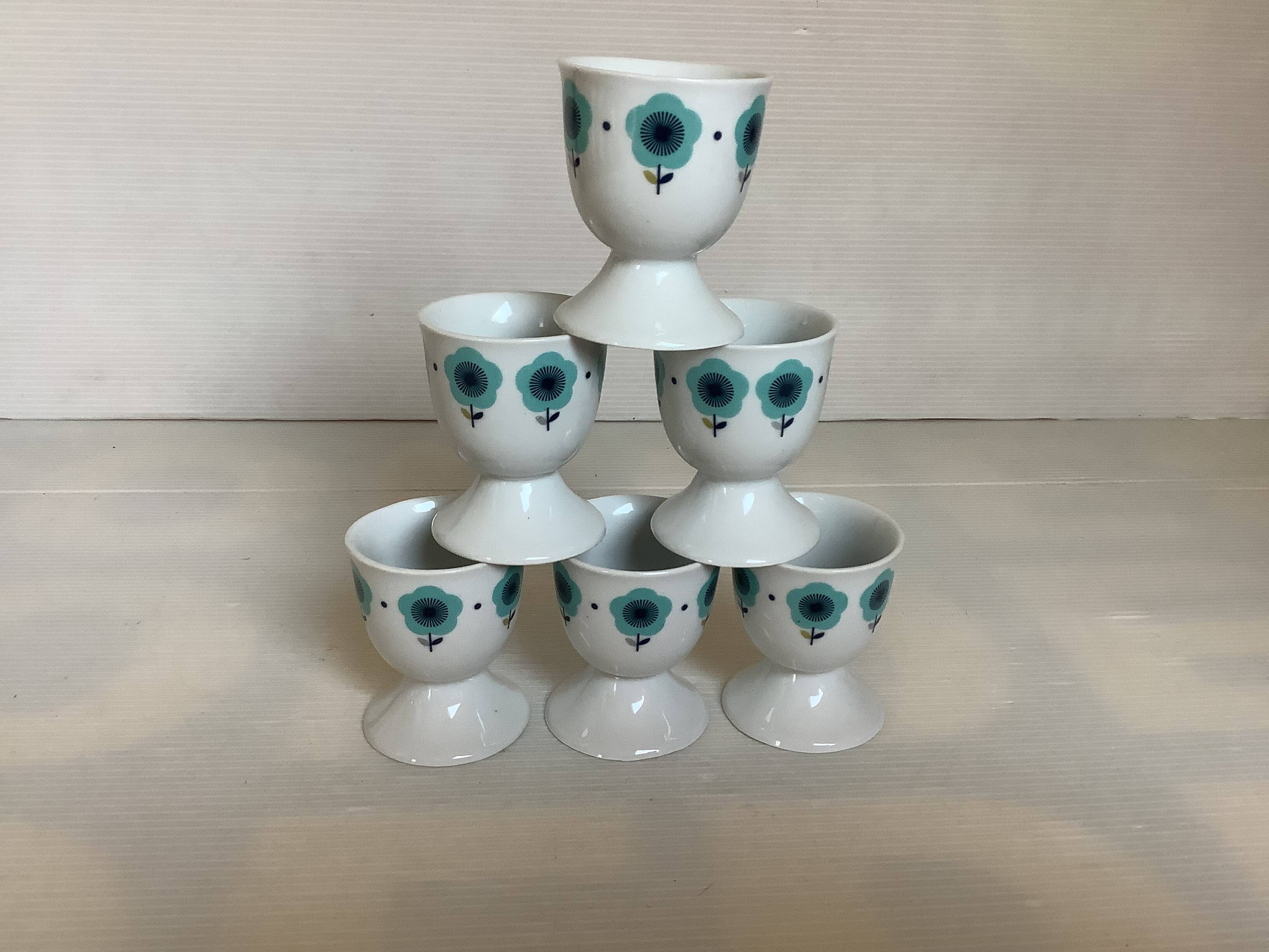 Six blue flower egg cups