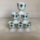 Six blue flower egg cups