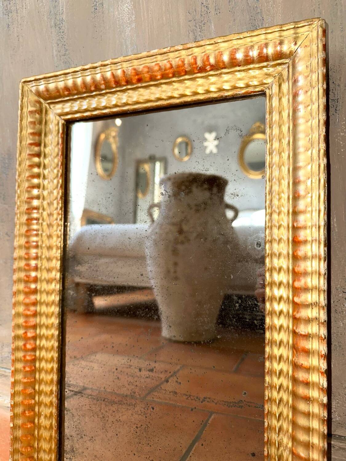 Antique gilded mirror from the Directoire period, 19th century.