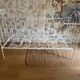 Small renovated wrought iron bed