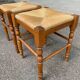 2 square stools made of carved solid wood with rush seats from the 1970s.
