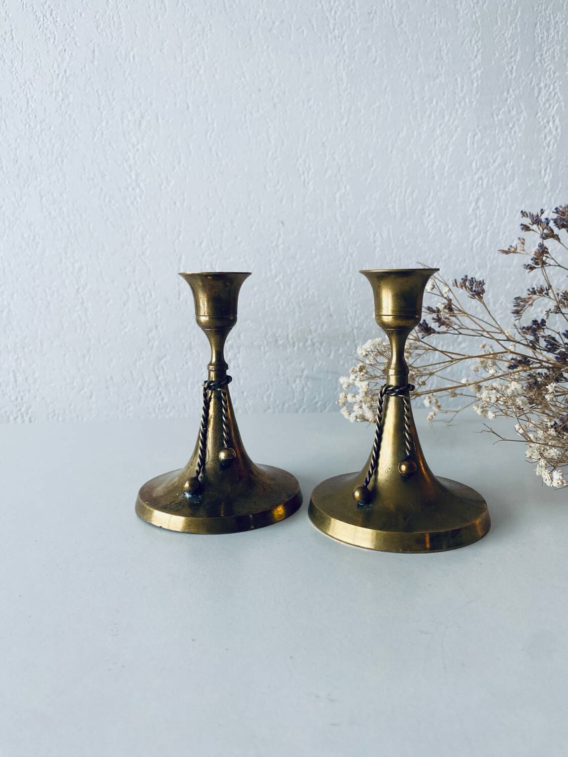 Pair of brass cord candle holders