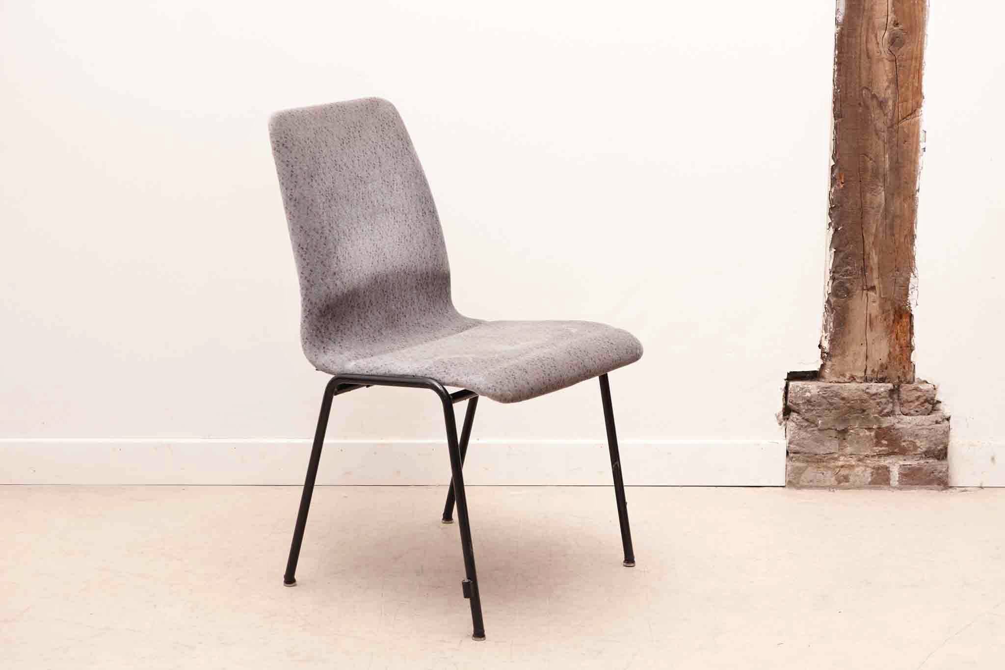Grey fabric chair with pattern and black legs