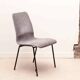 Grey fabric chair with pattern and black legs
