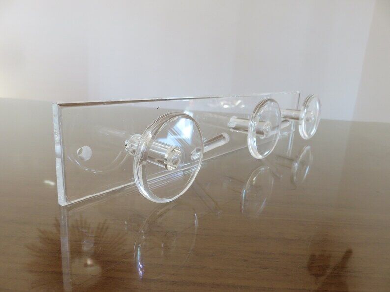 Wall coat rack in transparent plexiglass 3 hooks. 1980