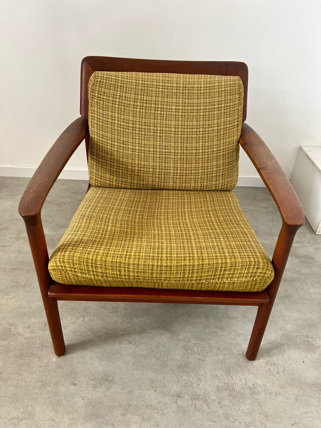 Old Scandinavian design armchair in vintage teak year 60