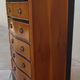 Louis XVI style chest of drawers in wood and cherry veneer.