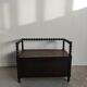 Natural wood chest forming a bench, ringed shoulders