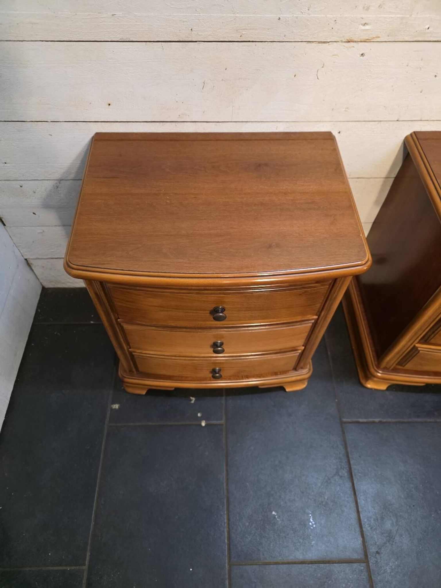 Pair of Louis Philippe style bedside tables in cherry wood.