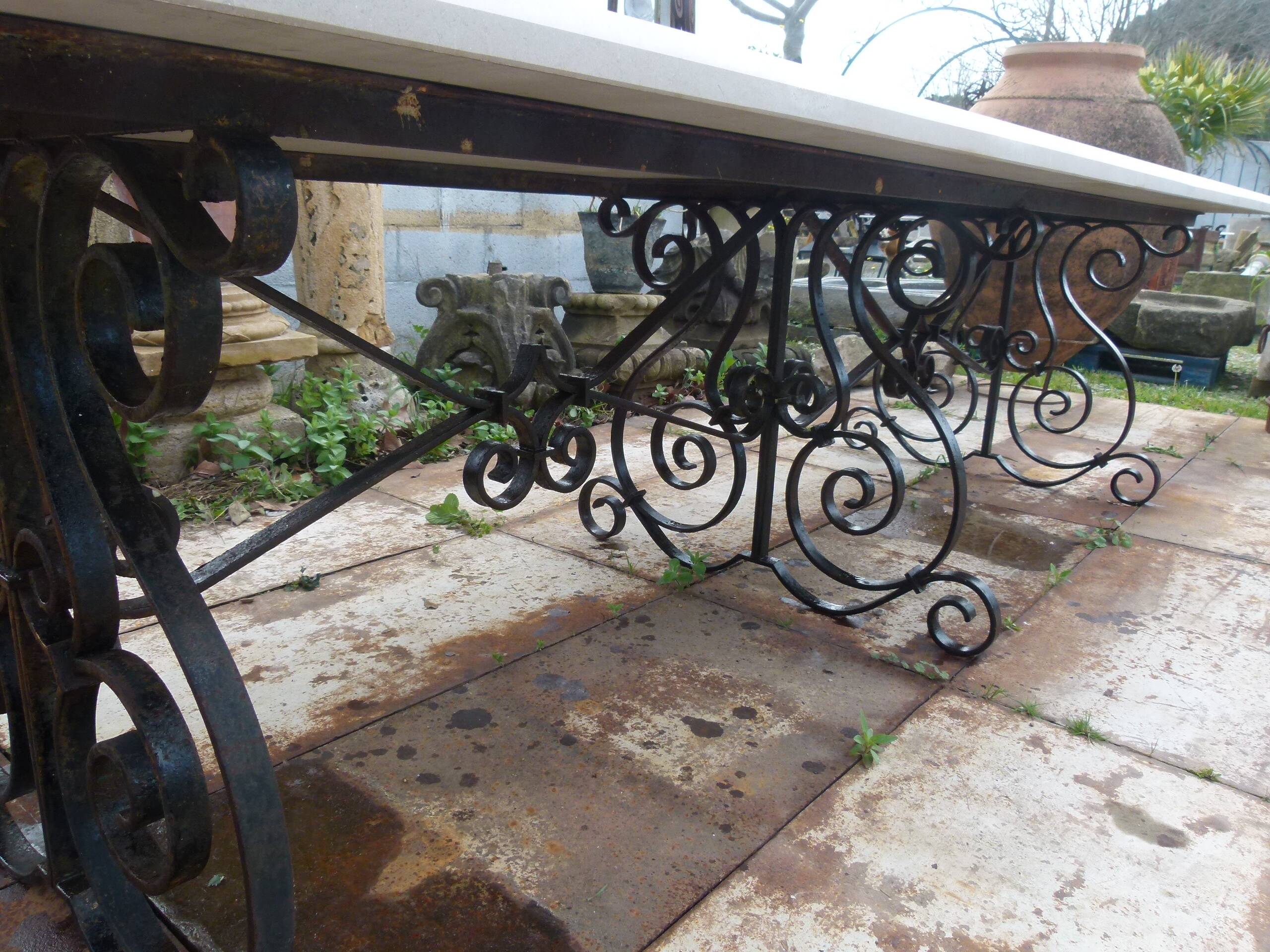 Marble table with wrought iron legs.