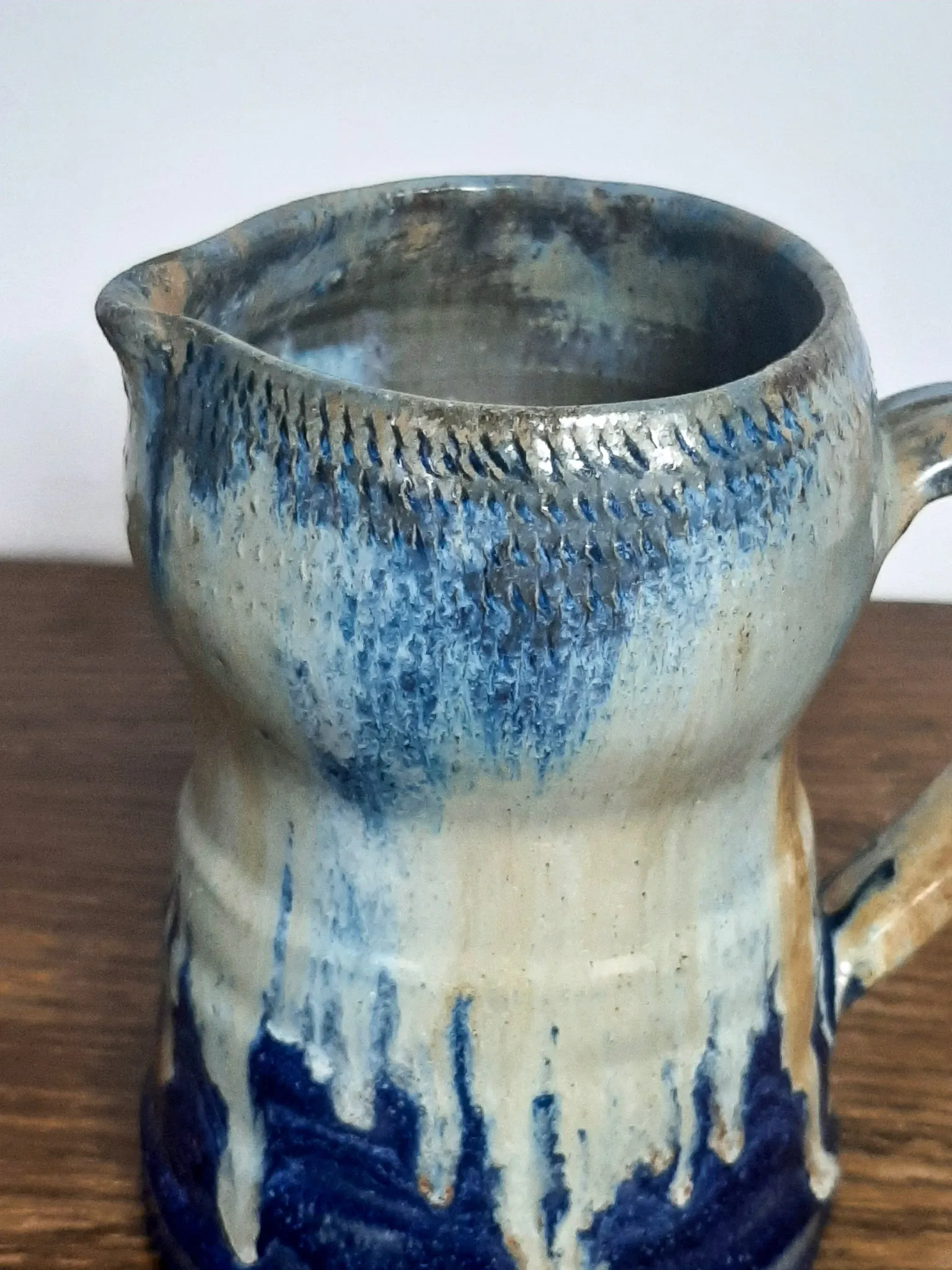 Blue flamed stoneware jug