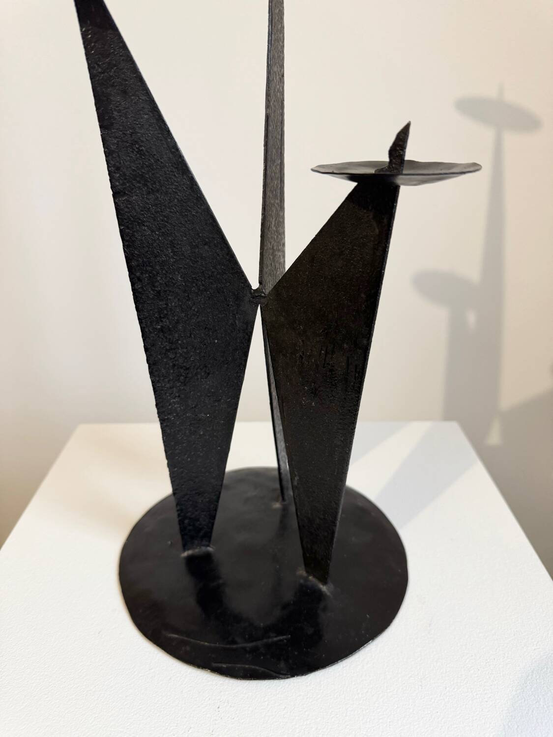 Vintage black metal brutalist tripod candlestick