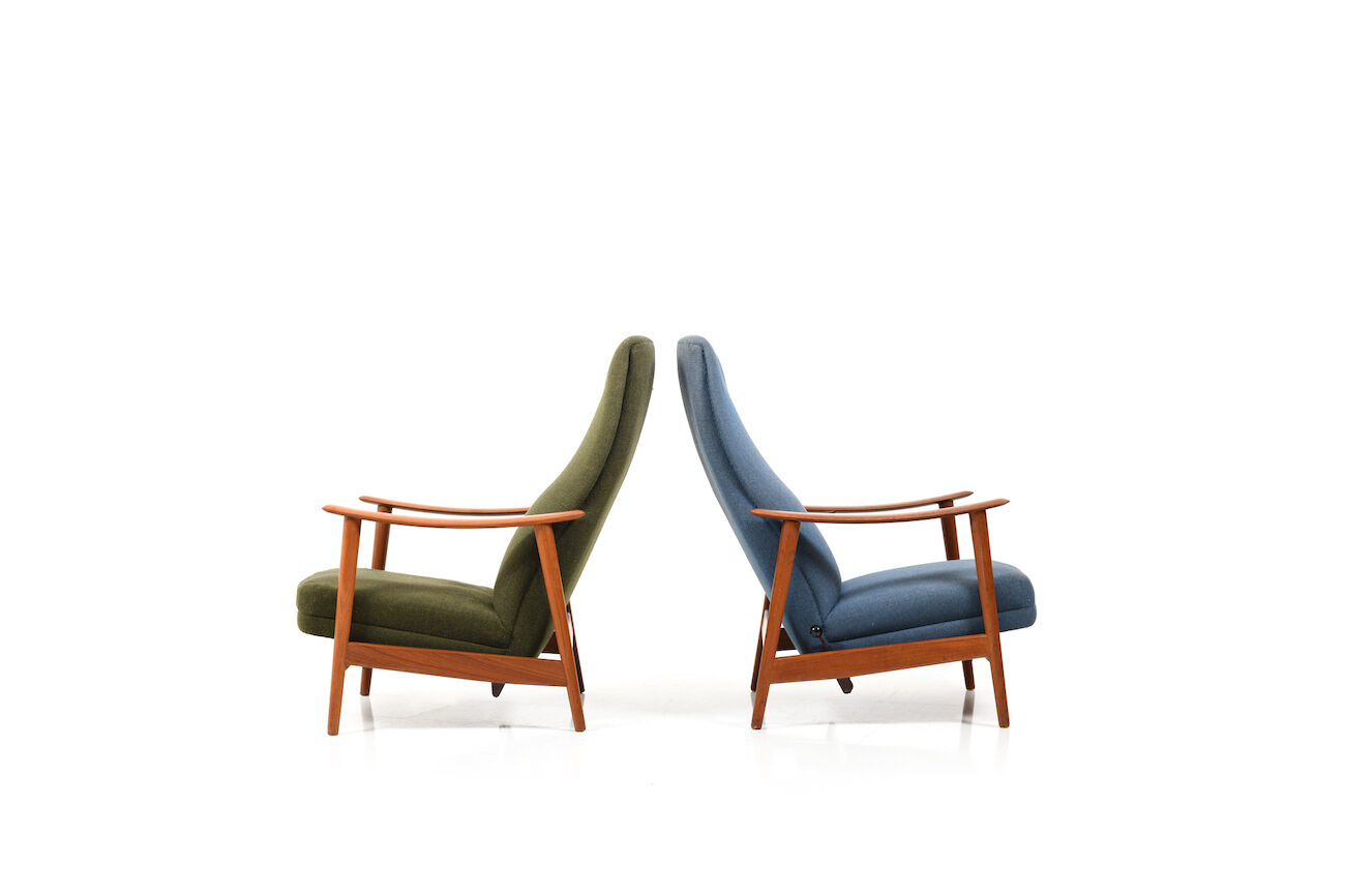 Pair of mid century Danish reclining lounge chairs in teak