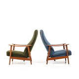 Pair of mid century Danish reclining lounge chairs in teak