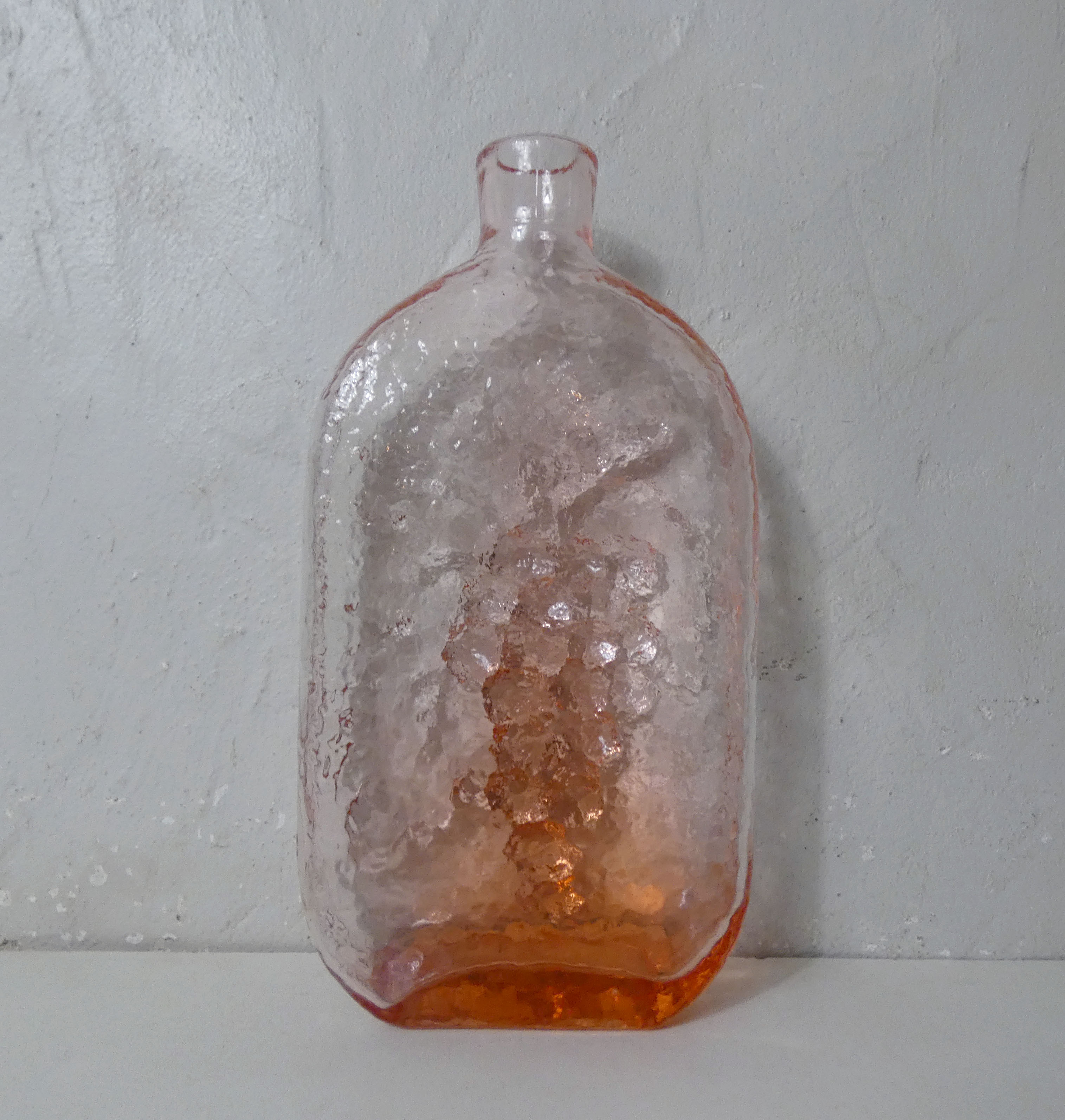 old carafe in orange pink glass