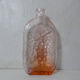 old carafe in orange pink glass