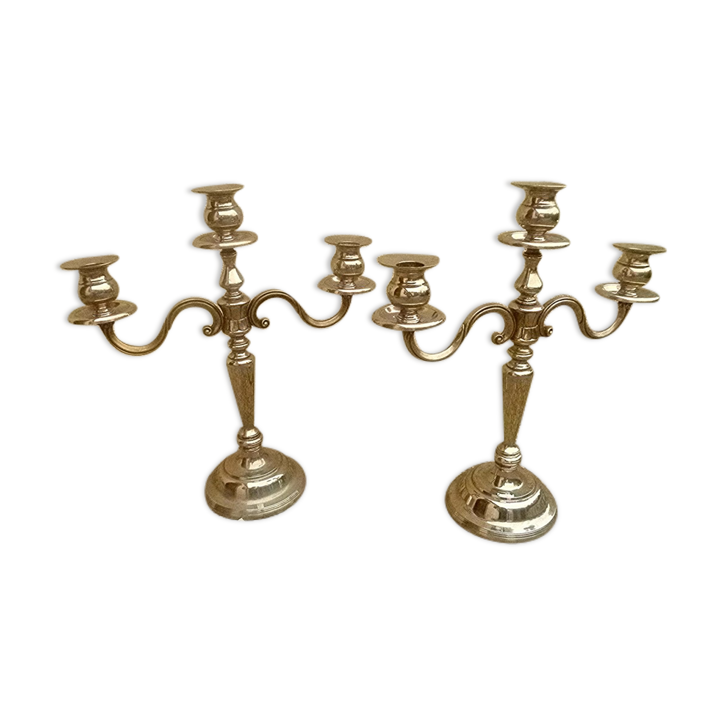 Pair of silver-colored metal candlesticks
