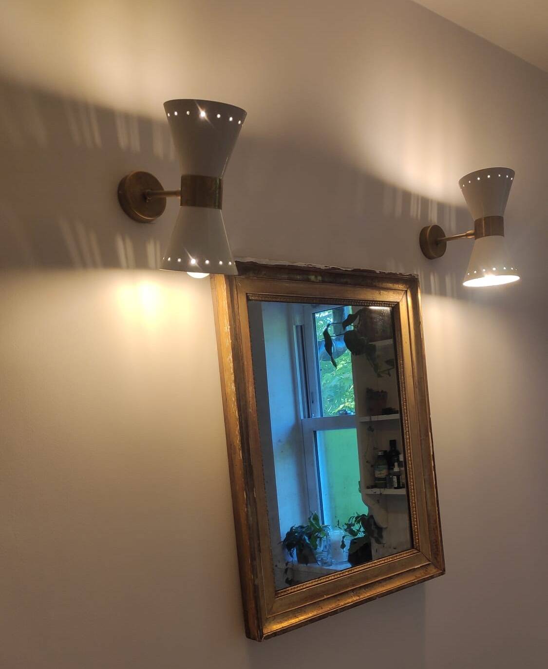 Pair of diabolo design wall sconces from the 1950s