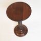 Wooden pedestal table with spiked columns
