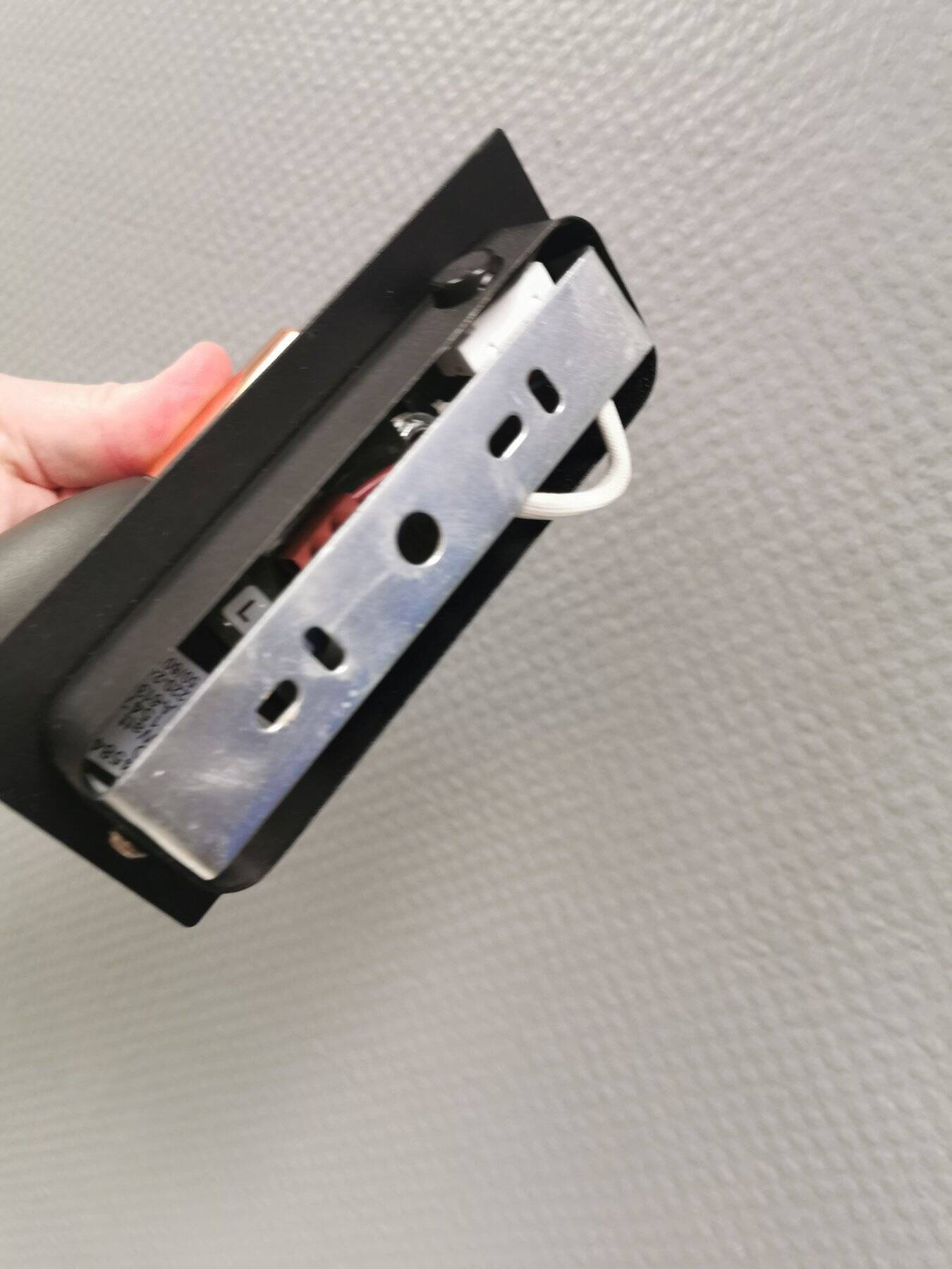 A pair of wall lamps from Eglo, in copper color and black.