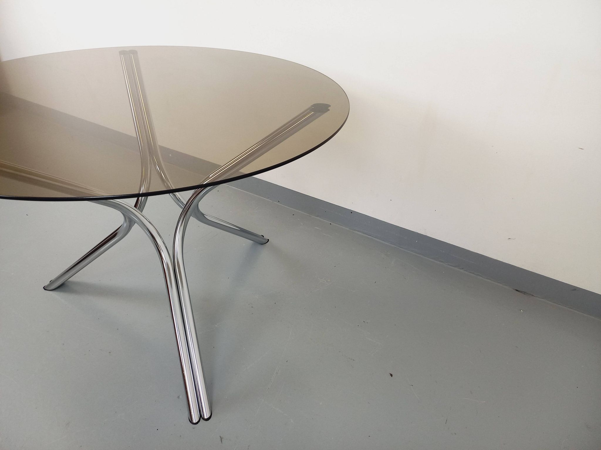 Vintage round dining table in smoked glass and chromed metal, Space Age style, from the 70s