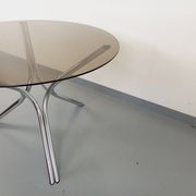 Vintage round dining table in smoked glass and chromed metal, Space Age style, from the 70s