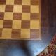 Pedestal table chessboard inlaid old pegs and staples