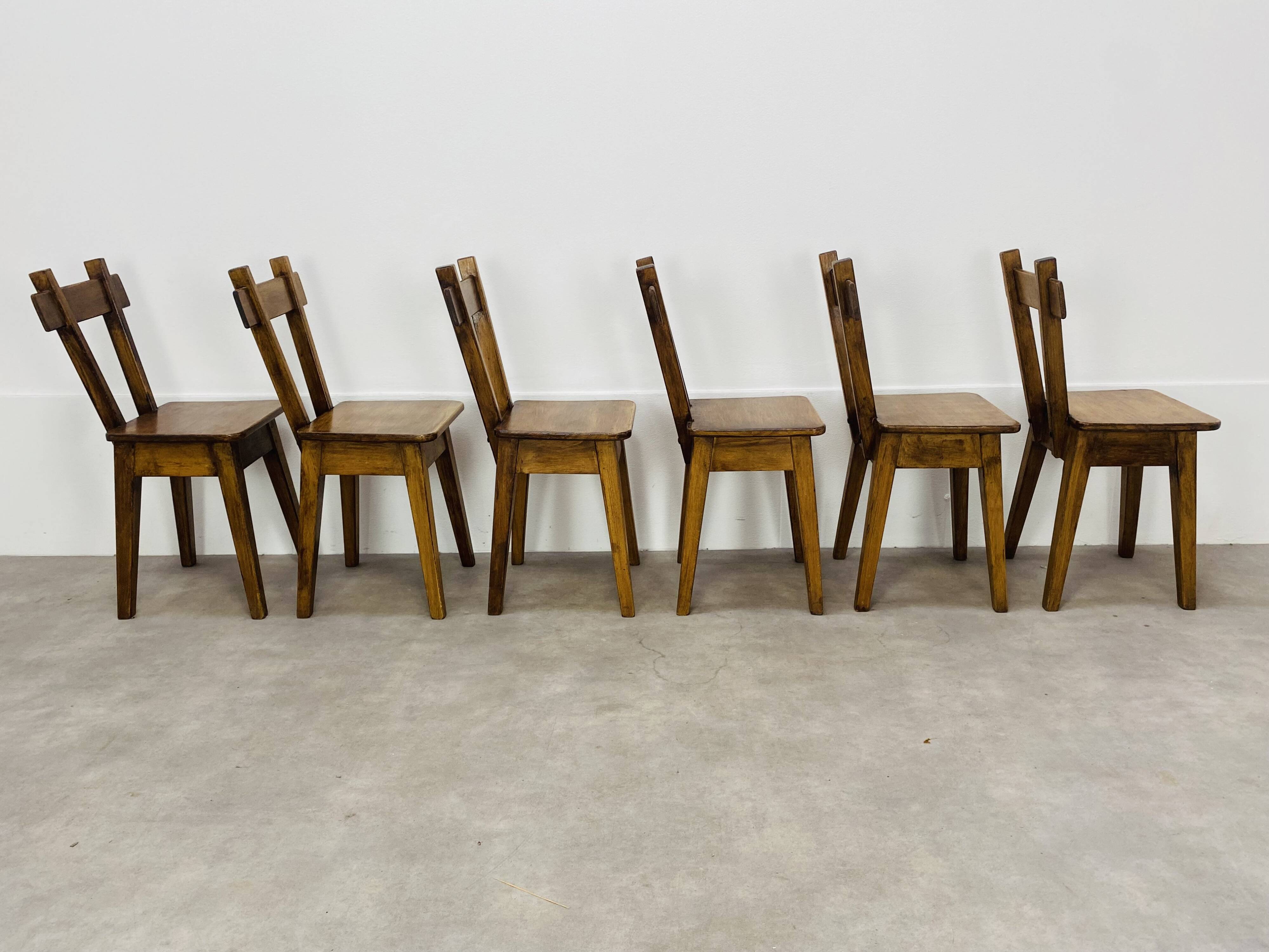 6 brutalist solid wood chairs
