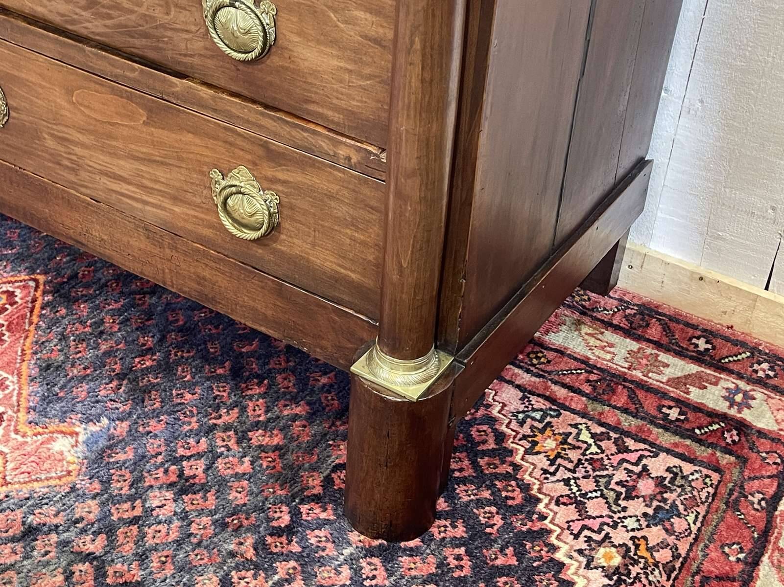 19th century Empire chest of drawers in cherry wood and black marble