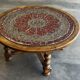 Vintage coffee table in turned wood and leather with astrological decoration.