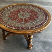 Vintage wooden turned coffee table with leather and astrological decoration.