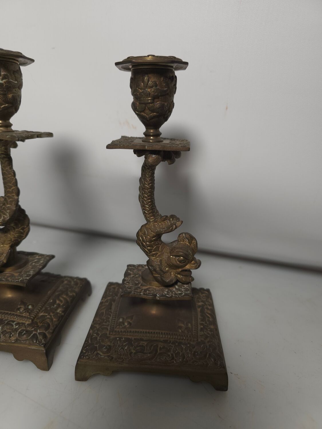 Pair of candlesticks with bronze dolphins