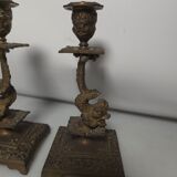 Pair of candlesticks with bronze dolphins