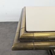 Table basse des années 80 en tubes de laitons et stratifié