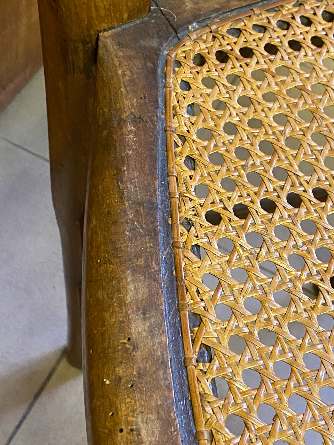 Antique wooden chair, cane seat